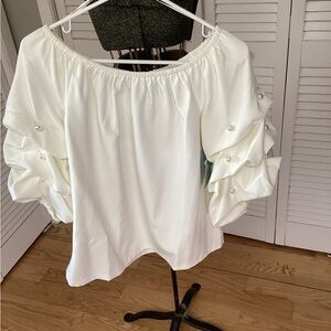 Cece white blouse with pearls on the oversized sl